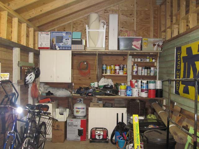 Shelf in shed holding extra boxes