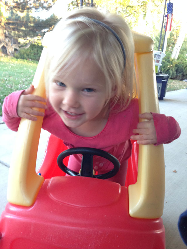 Toddler in Little Tikes Cozy Coupe