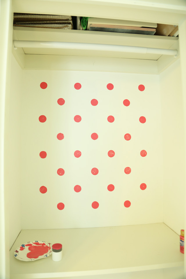 pink polka dots on white closet wall accent